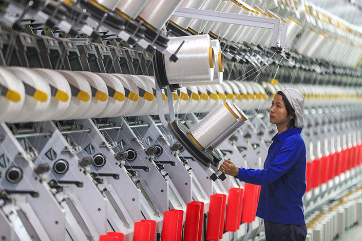 A worker stands on the production line of a textile factory in East China’s Jiangsu province in 2020. Photo: VCG