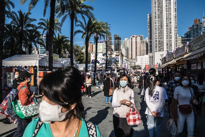 Hong Kong is also facing its own flare-up, with local infections rising and health officials warning about the strain on the health-care system from both Covid and influenza.