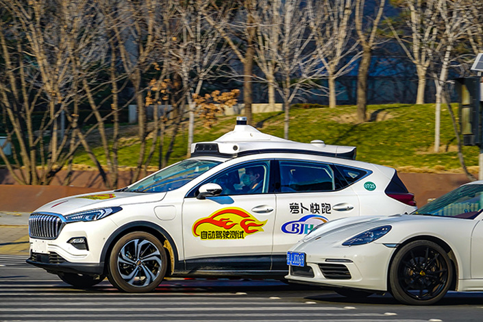 One of Baidu’s Apollo Go robotaxis drives down a road in Beijing in December 2021. Photo: VCG