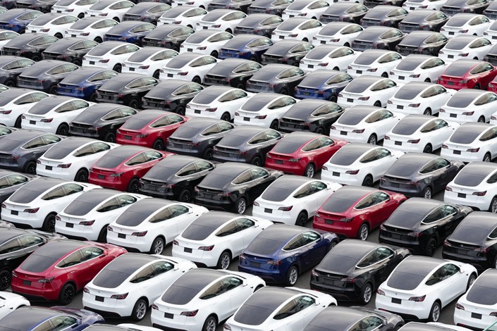 Tesla vehicles sit in a parking lot on Oct. 28 after arriving at a port in Yokohama, Japan. Photo: Bloomberg