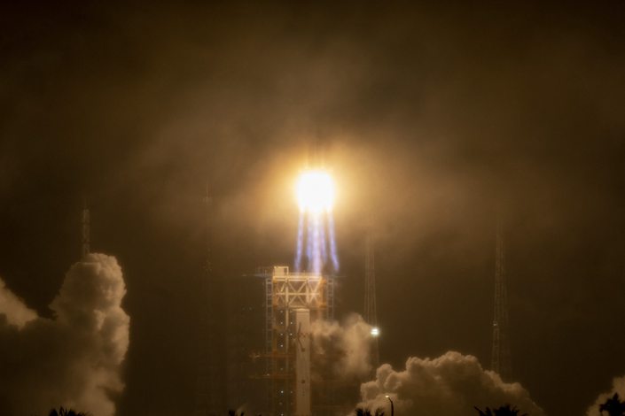 A Long March-7 rocket carrying satellites blasts off from South China’s Hainan province on Monday. Photo: Bloomberg