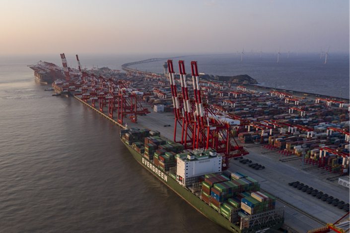 A ship sits berthed at the Yangshan Deepwater Port in Shanghai on Tuesday. Photo: Bloomberg