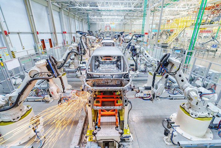 Robots weld the frame of a new-energy vehicle on Dec. 8 at a factory in Yuncheng, North China's Shanxi province. Photo: VCG