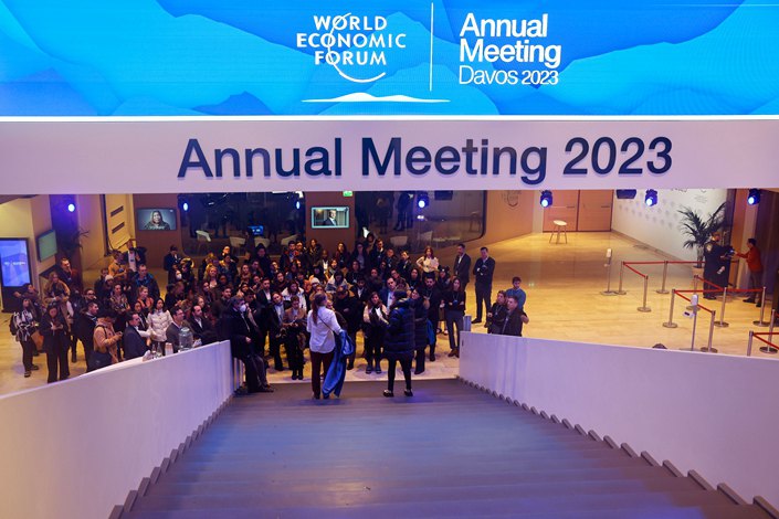 Workers attend a briefing session Sunday ahead of the World Economic Forum in Davos, Switzerland. Photo: VCG