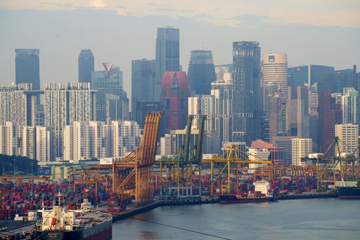 Gantry cranes and stacked containers at the Tanjong Pagar Terminal near the central business district in Singapore, on Nov. 7, 2021. Photo: Bloomberg