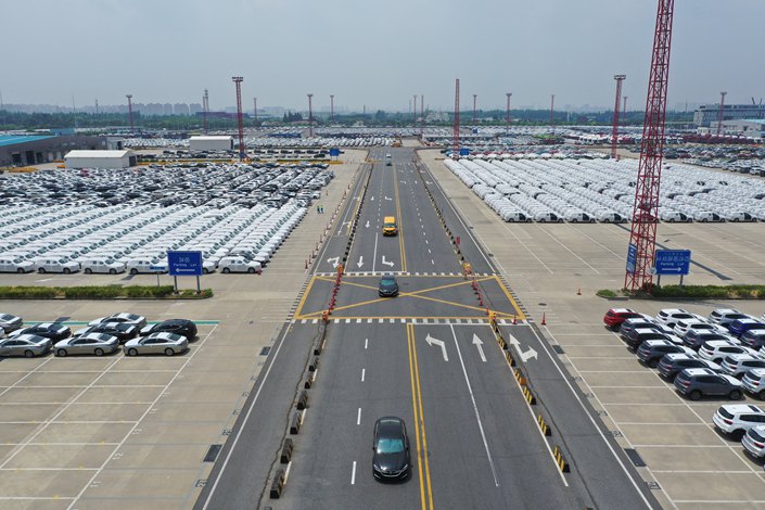 New-energy vehicles sit parked awaiting export at the Shanghai Haitong International Automobile Terminal on Aug. 2. Photo: VCG