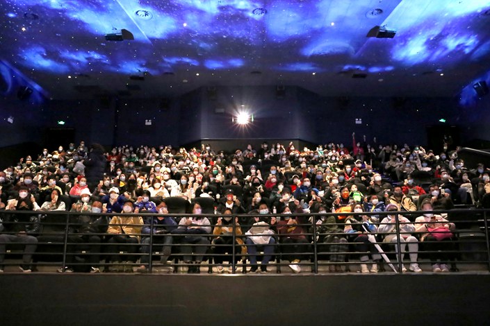 Movie-goers in Shanghai attend a film screening on Jan. 22. Photo: VCG