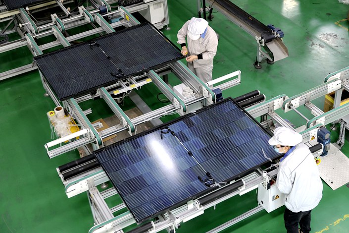 Solar photovoltaic panels are being produced at a plant in Lianyungang, Jiangsu province, on Jan. 3. Photo: VCG