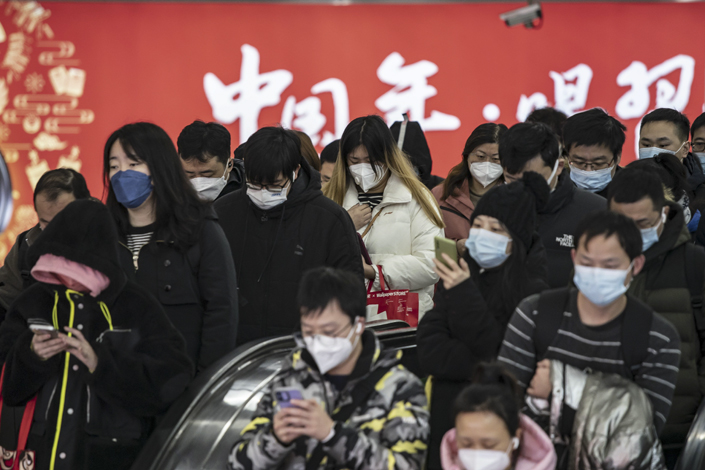 Commuters walk through a subway station in Shanghai on Jan. 3. Photo: Bloomberg