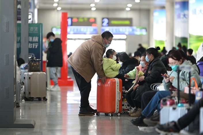 Passengers wait at a railway station in Hohhot, Inner Mongolia, on Feb. 4. Photo: VCG