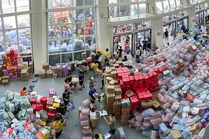 Following a flood, supplies get stockpiled at a stadium in Xinxiang, Central China’s Henan province, in July 2021. Photo: Dake Kang/VCG