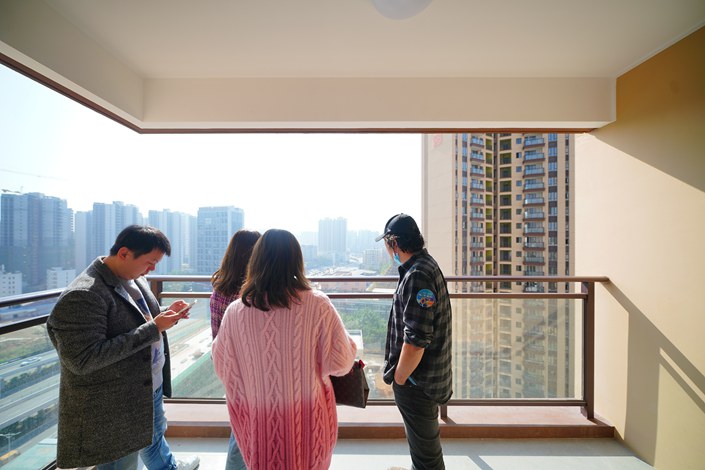 On Feb. 17, 2023, in Huizhou, Guangdong province, local residents look at an apartment. Photo: VCG