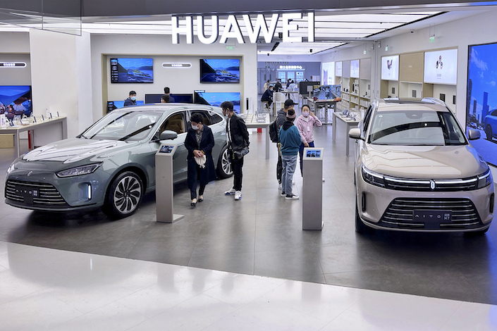 Seres AITO cars in display in a Huawei store in Beijing.