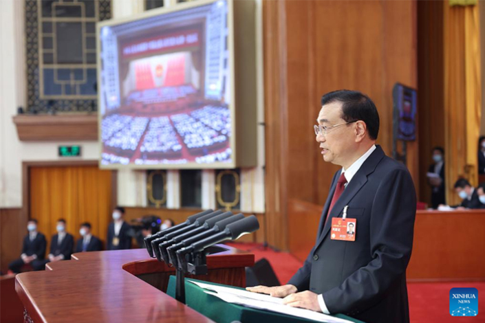 Premier Li Keqiang delivers the government work report Sunday at the opening of the first session of the 14th National People’s Congress at the Great Hall of the People in Beijing. Photo: Ju Peng/Xinhua