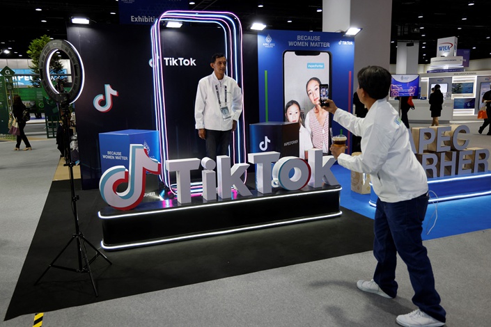 A man poses in the TikTok photobooth at the international media center during the Asia-Pacific Economic Cooperation (APEC) summit in Bangkok on November 18. Photo: VCG