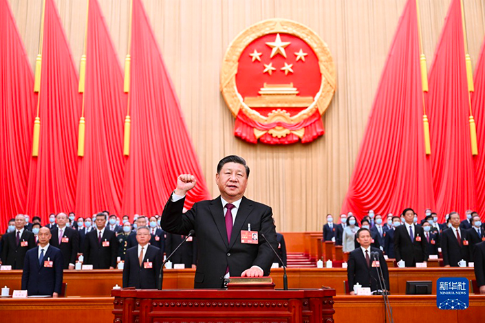 Xi took a public oath of allegiance to the Constitution of China in the presence of almost 3,000 congressional delegates in the Great Hall of the People on Friday. Photo: Xinhua