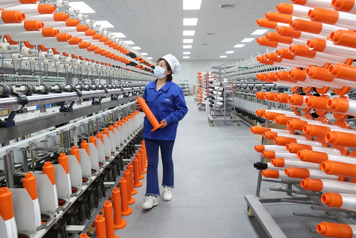 An employee on duty at a fiber product manufacturing enterprise in Suqian, Jiangsu province, on March 28. Photo: VCG