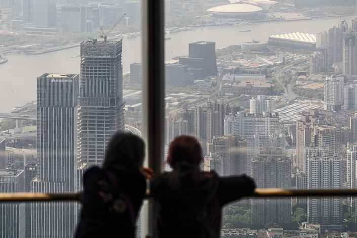 pictureVisitors take in the view from the observation deck of the Shanghai Tower in Shanghai on April 9. Photo: Bloomberg