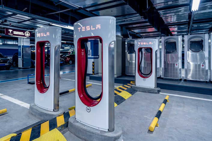 Tesla said it is letting models produced by 30 automakers use its charging stations. Photo: VCG