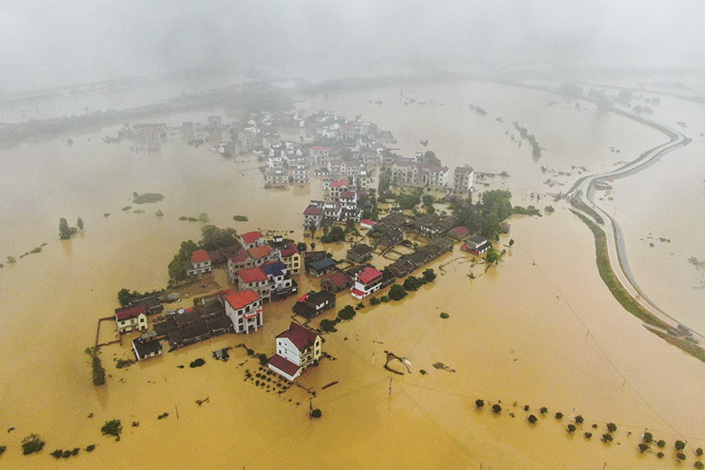 Floodwaters submerge houses and fields in Jiangxi province's Licun county on Saturday. Photo: Liu Lixin/China News Service, VCG