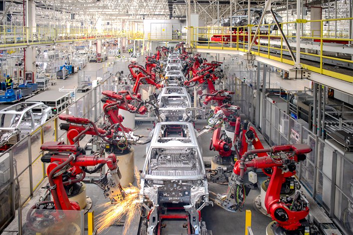 Industrial robots weld cars on April 26 on a smart production line at a Zhejiang Leapmotor Technologies Ltd. factory in Jinhua, East China’s Zhejiang province. Photo: VCG