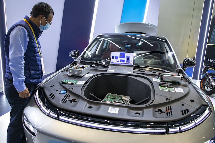 An electric car equipped with STMicroelectronics’ silicon carbide chip displayed at China International Import Expo in Shanghai Nov. 8, 2021.