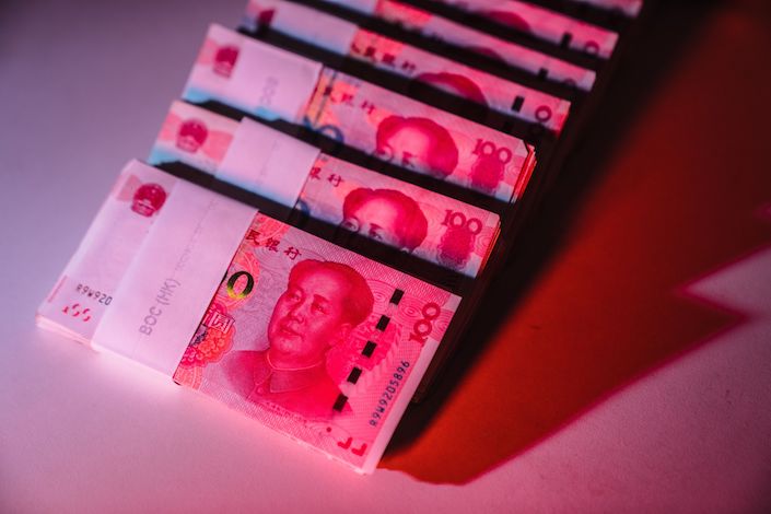 The yuan weakened past the closely watched level of 7.2 per dollar Wednesday