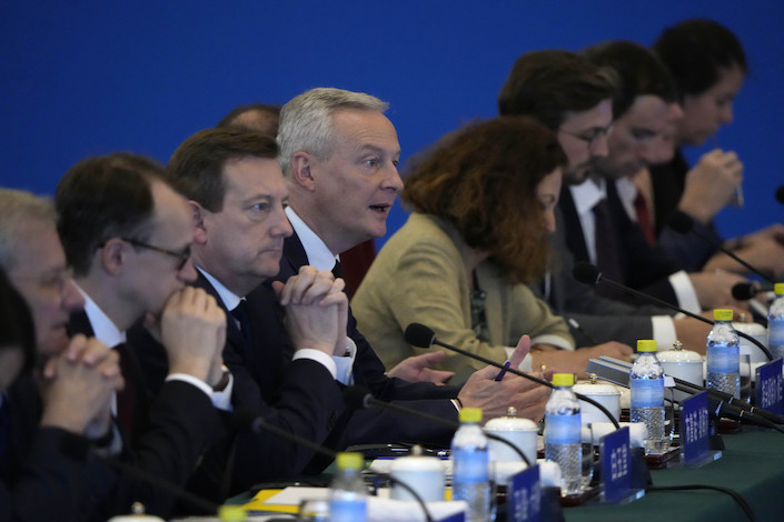 French Finance Minister Bruno Le Maire, center, speaks at the Ninth China-France High Level Economic and Financial Dialogue July 29, 2023, in Beijing.