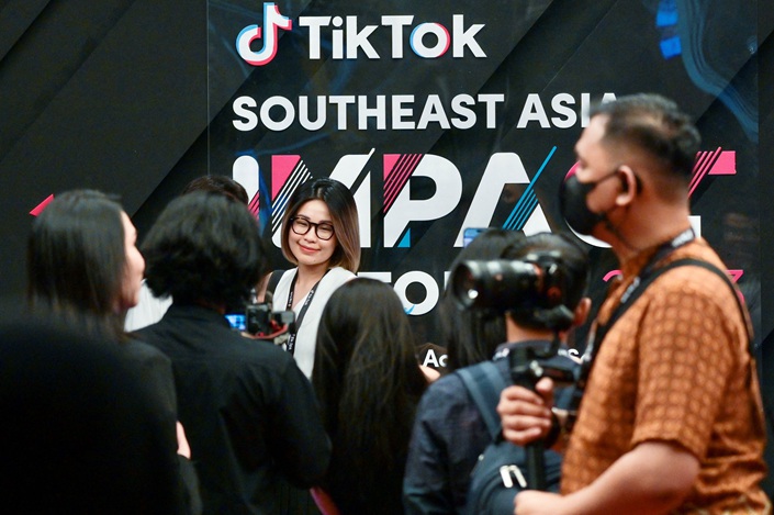 A woman poses for the camera at the TikTok Southeast Asia Impact Forum 2023 in Jakarta on June 15. Photo: Bay Ismoyo/VCG