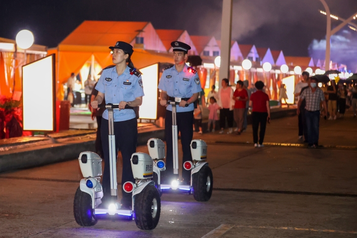 Police officers on segways patrol a night market on June 16 in Zhoushan, East China’s Zhejiang province. Photo: VCG
