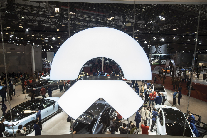 Visitors check out Nio’s booth at the Shanghai Auto Show on April 24. Photo: Bloomberg