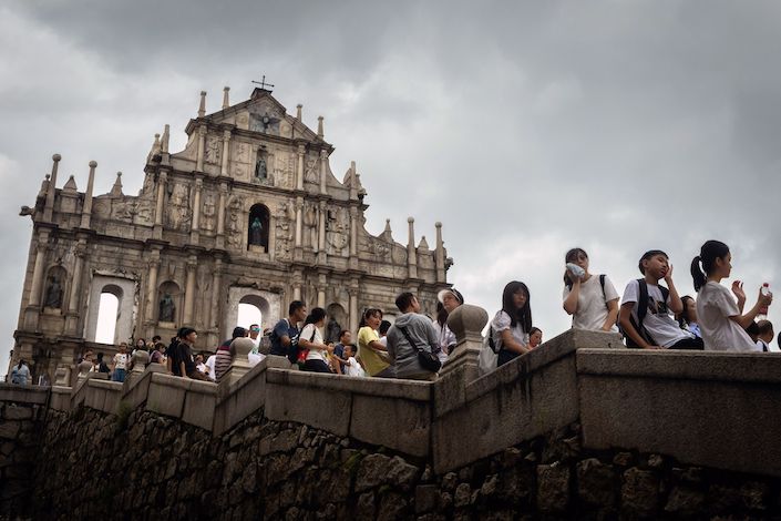 Visitors explore the Ruins of St. Paul’s in Macau on Aug. 24. Photo: Bloomberg