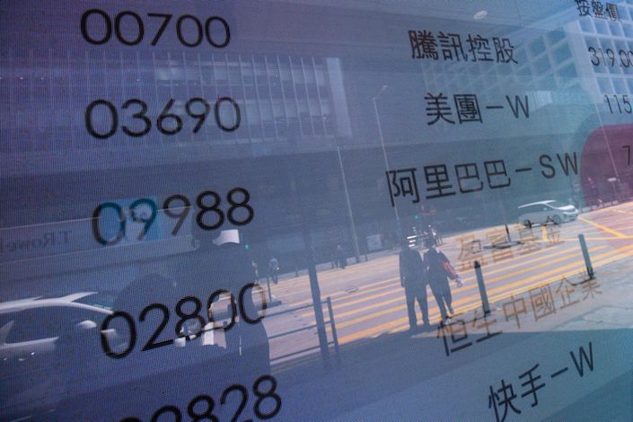 An electronic screen displays the stock tickers for companies including Tencent, Meituan and Alibaba in Hong Kong in March 2022. Photo: Bloomberg