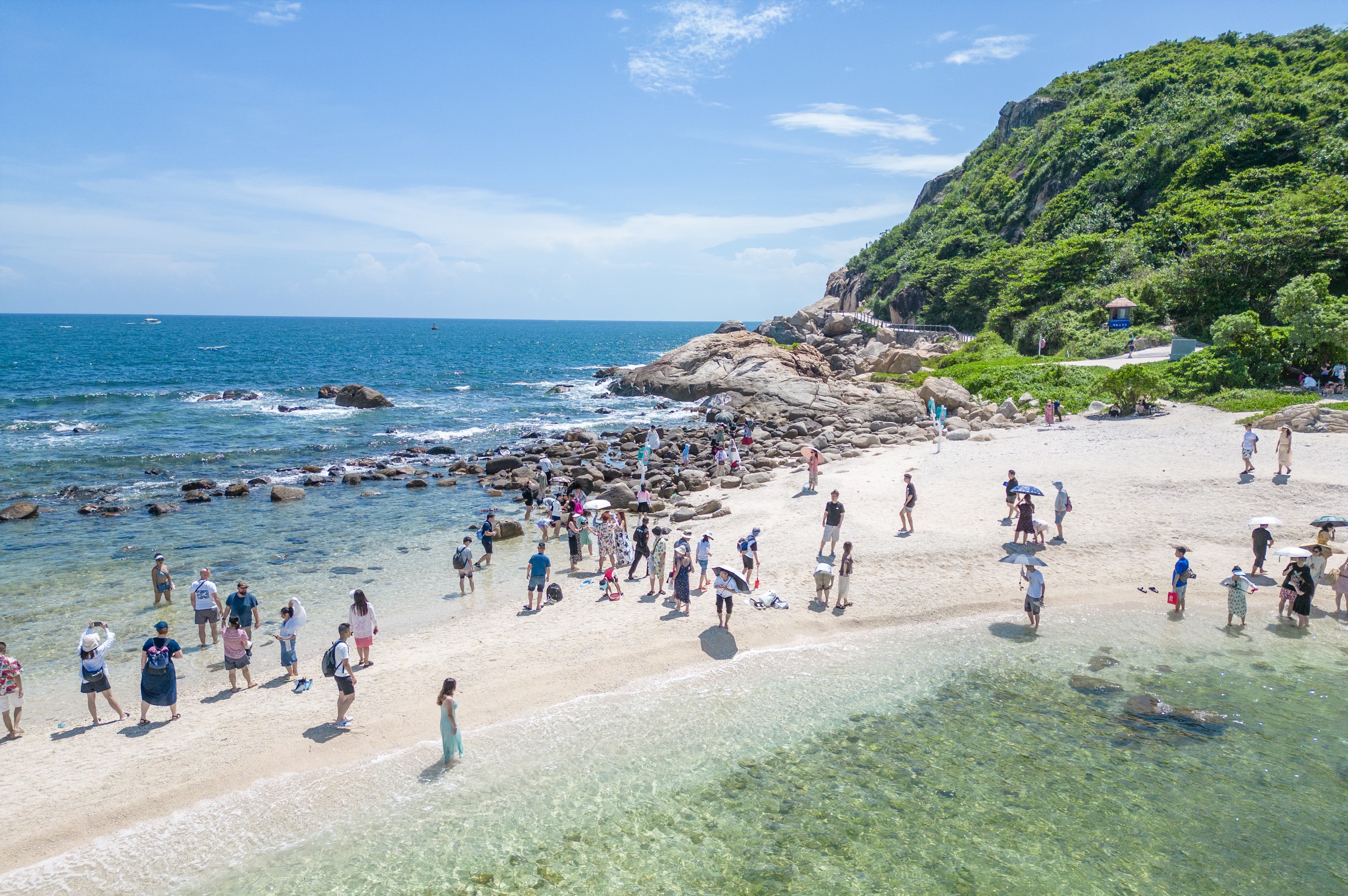 Beachgoers enjoy themselves in Sanya, a renowned holiday destination on the island of Hainan, on Oct. 3, 2022. Photo: IC Photo