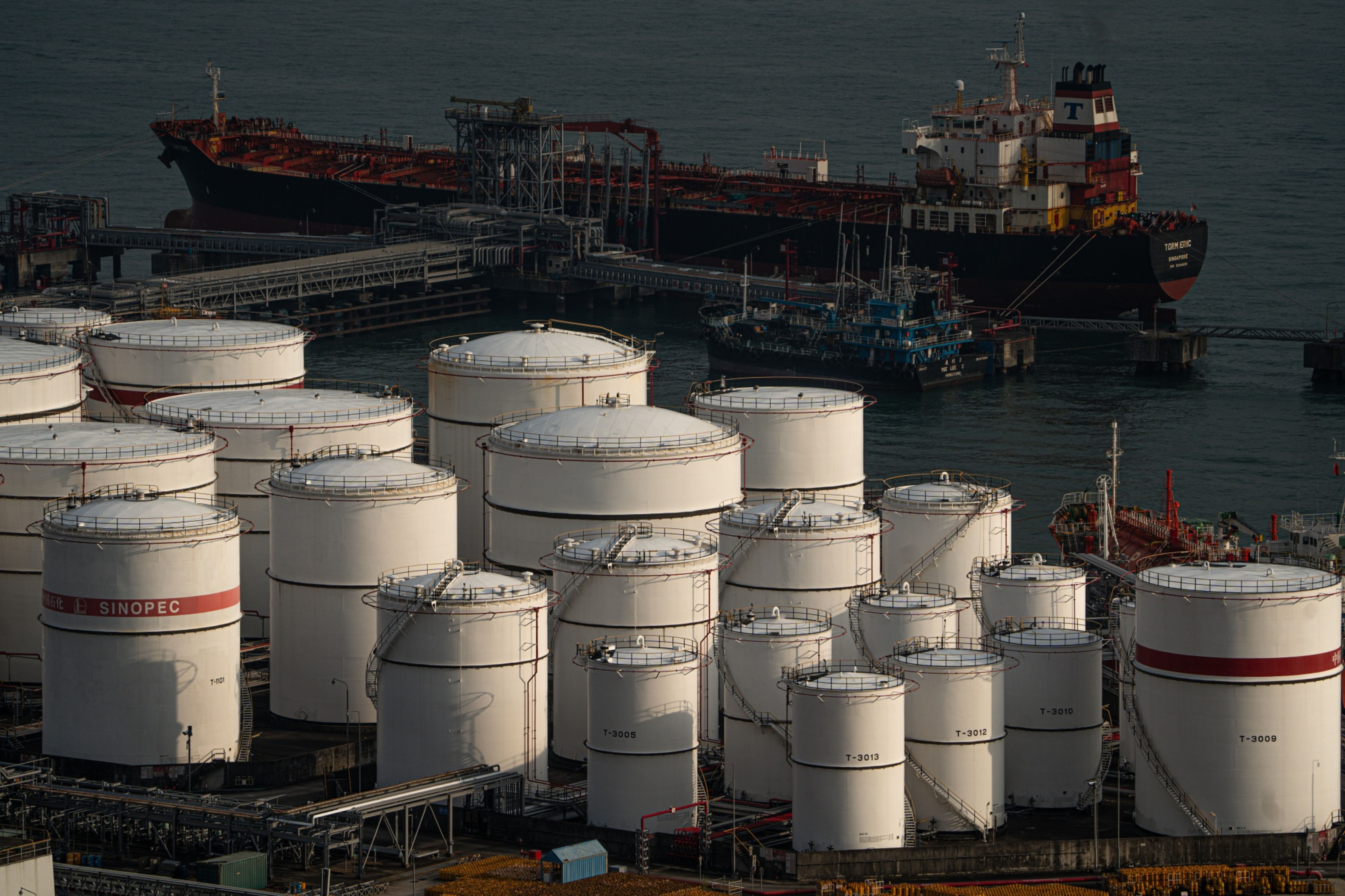 Sinopec storage tanks sit at a container terminal in Hong Kong on Nov. 14. Photo: Bloomberg