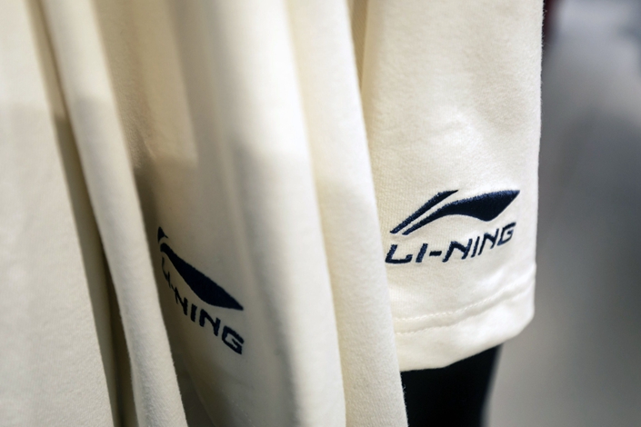 Li Ning apparel hangs on display in February 2022 at one of the company’s stores in Shanghai. Photo: Bloomberg