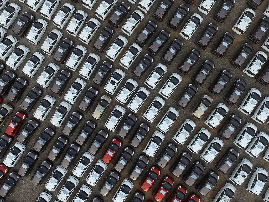 Electric vehicles at a manufacturing site in North China in 2016. Photo: VCG