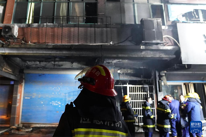 Firefighters work at the scene of a fire Wednesday in Xinyu, East China’s Jiangxi province. Photo: Xinhua