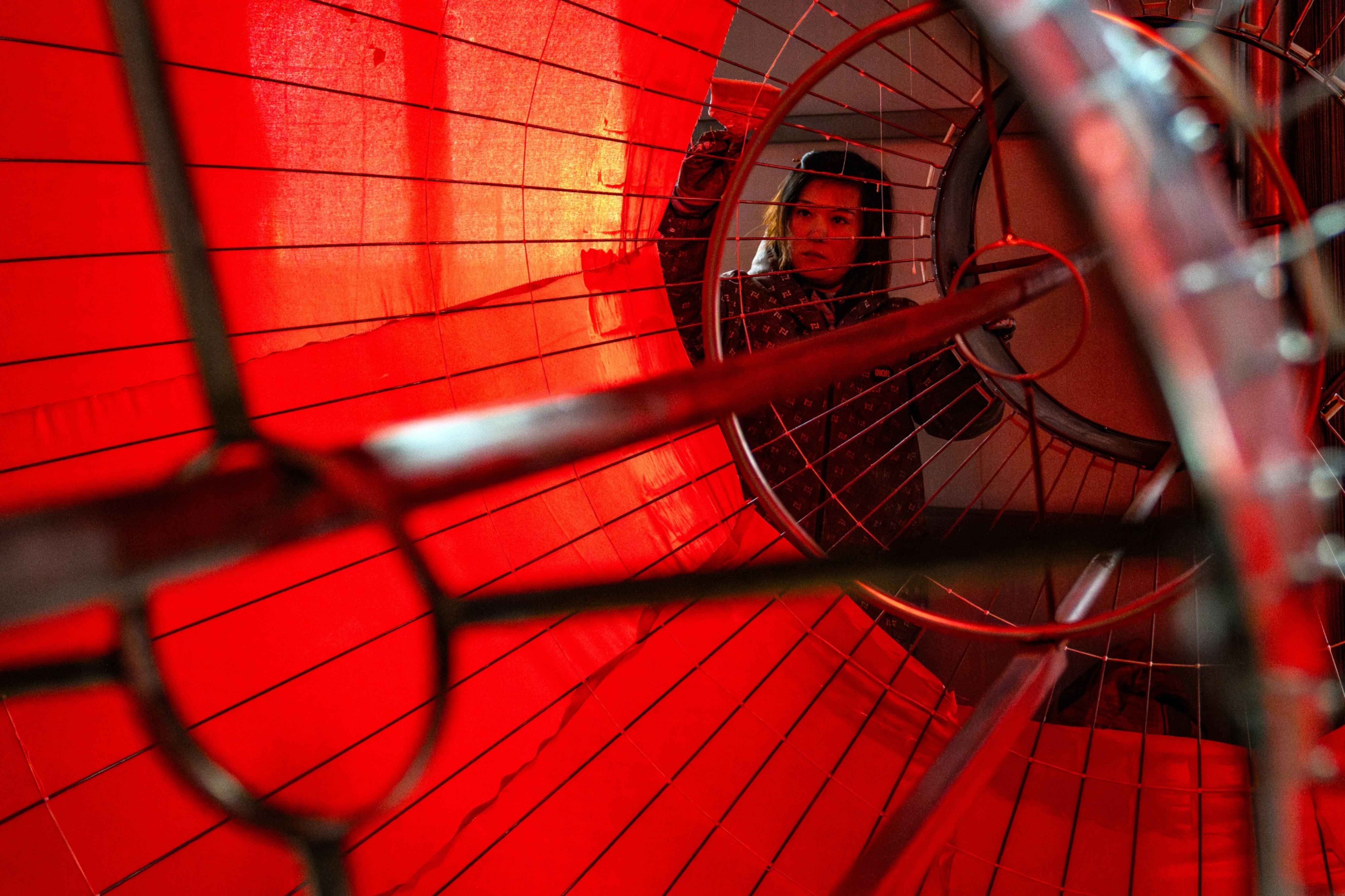 A worker assembles a traditional Chinese lantern at a factory in the village of Tuntou near Shijiazhuang, North China’s Hebei province. Photo: Bloomberg