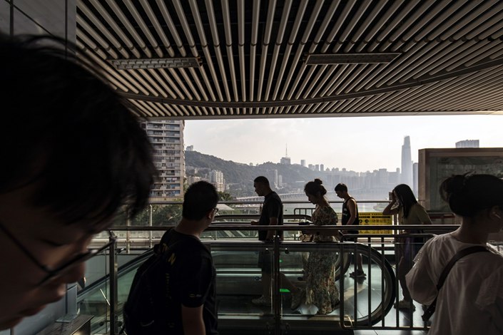 Passengers at a railway station in the southwestern Chinese city of Chongqing on Sept. 3. Photo: Bloomberg