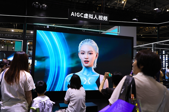 Attendees of the World Artificial Intelligence Conference check out AI-generated virtual figures on July 8 in Shanghai. Photo: VCG