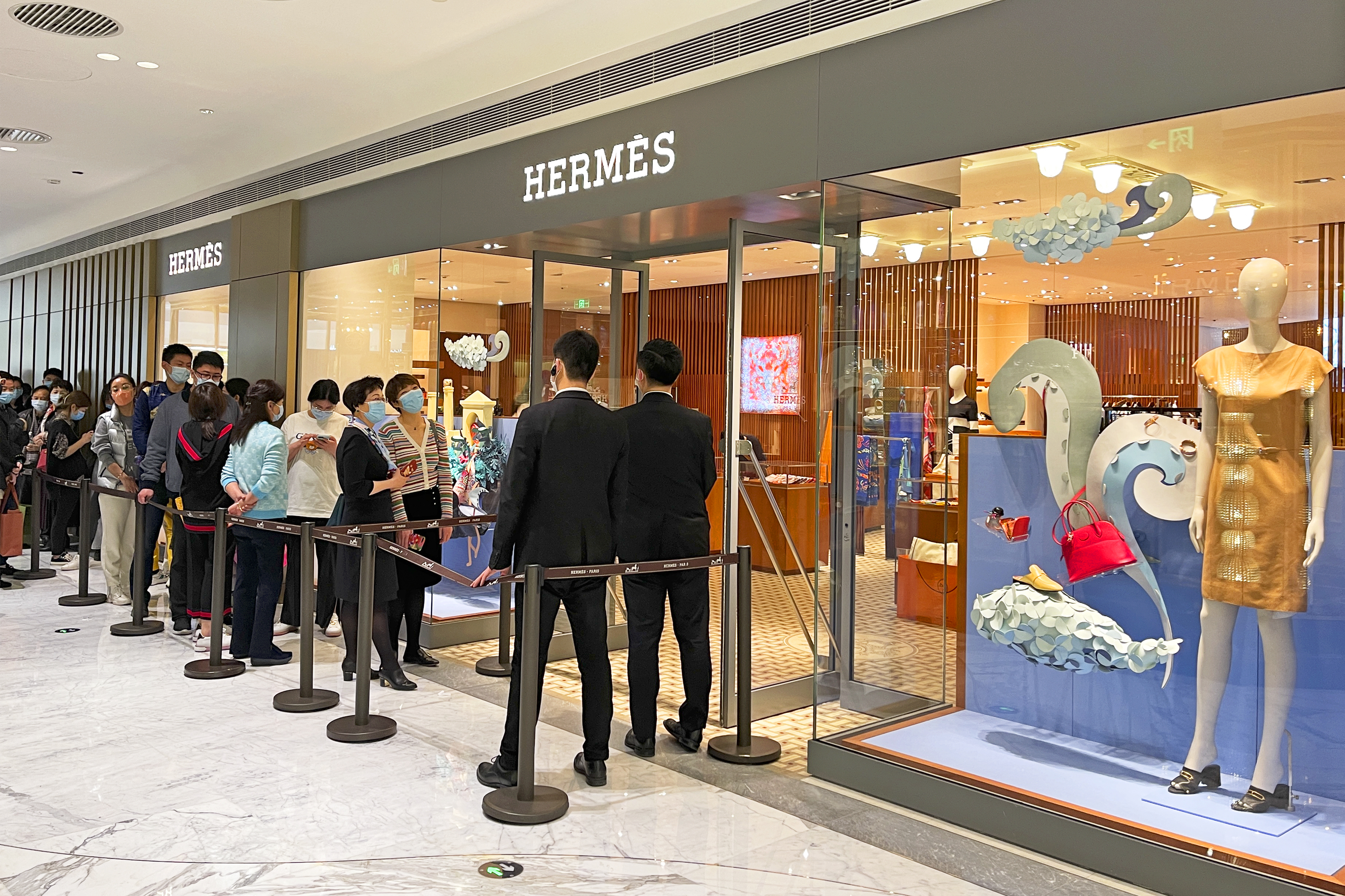 Customers line up outside a Hermès store in Beijing on March 27., 2021. Photo: VCG