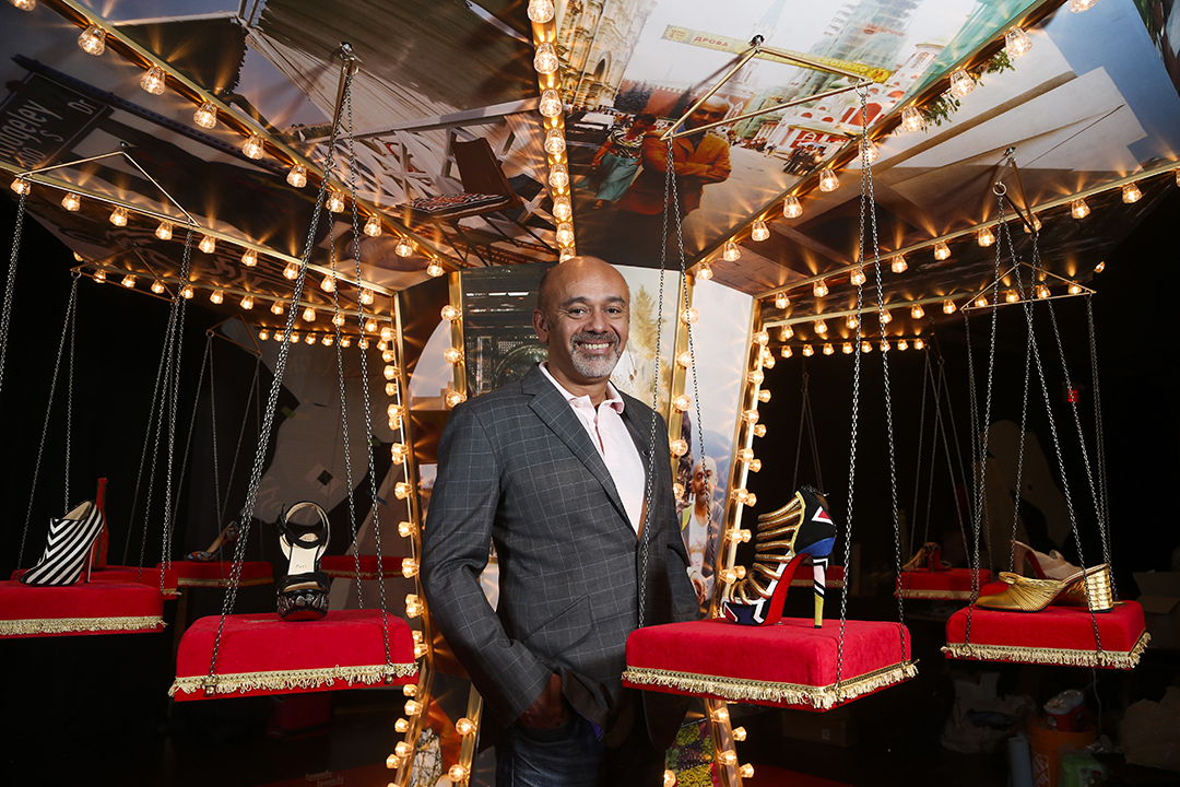 French footwear designer Christian Louboutin and shoes he designed. Photo: VCG