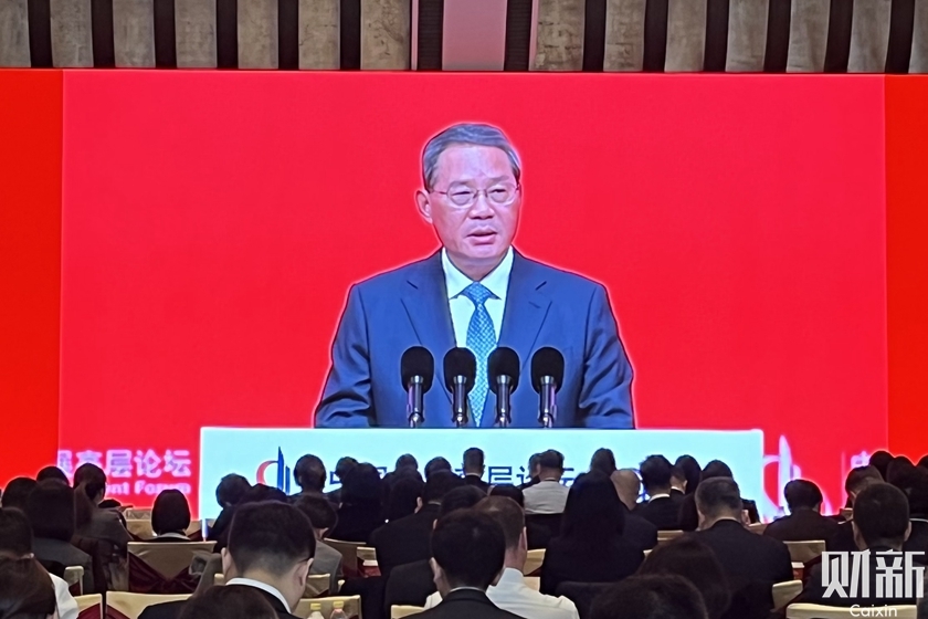 Premier Li Qiang delivers a speech at the opening ceremony of the China Development Forum 2024 Annual Meeting in Beijing on Sunday. Photo: Zeng Jia/Caixin