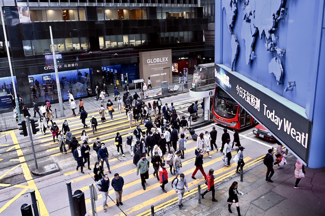Pedestrians walk through Central in Hong Kong on Jan. 10. Photo: VCG