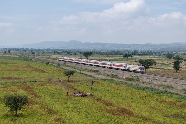 A passenger train coming from Addis Ababa passes through fields in Adama, Ethiopia, in November 2023. Photo: Ding Gang/Caixin