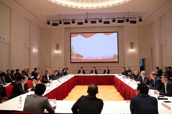 China’s Minister of Commerce Wang Wentao holds a roundtable meeting with representatives of 10 Chinese EV firms in Paris on April 7.
