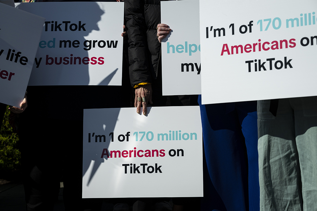 A group of Tik Tok creators and advocates hold signs before a news conference outside the U.S. Capitol in Washington, DC on March 12. Photo: Graeme Sloan/Bloomberg via Getty Images