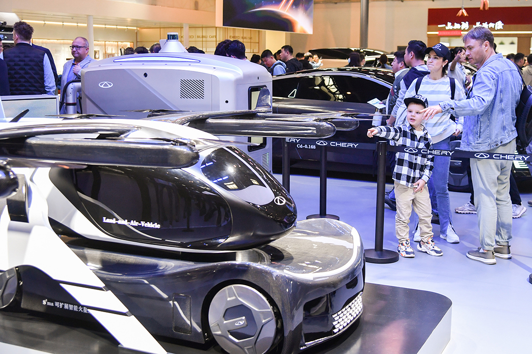 Foreign visitors look at Chery Automobile's concept flying car at the Beijing Auto Show on Monday. Photo: VCG